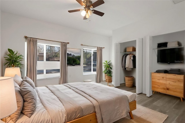 bedroom with a closet, dark hardwood / wood-style floors, and ceiling fan