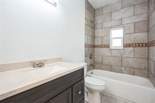 full bathroom with tiled shower / bath combo, vanity, and toilet