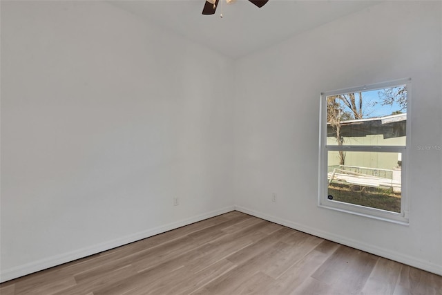 spare room with ceiling fan and light hardwood / wood-style floors