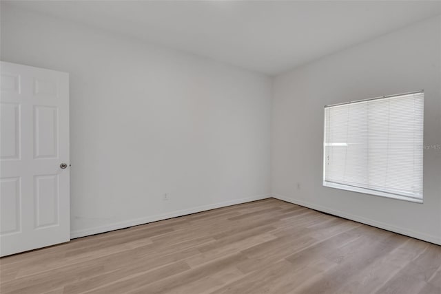 empty room with light hardwood / wood-style floors