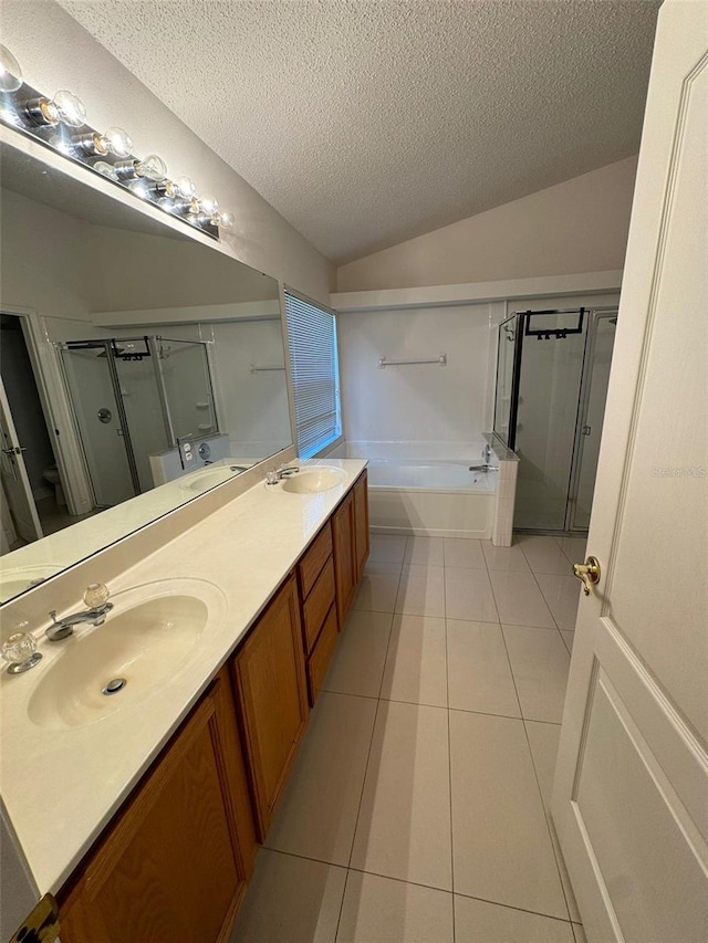 bathroom with tile patterned floors, shower with separate bathtub, lofted ceiling, and a textured ceiling