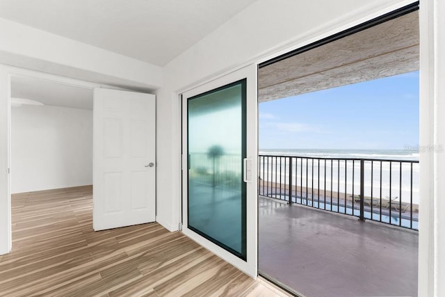 balcony with a view of the beach and a water view