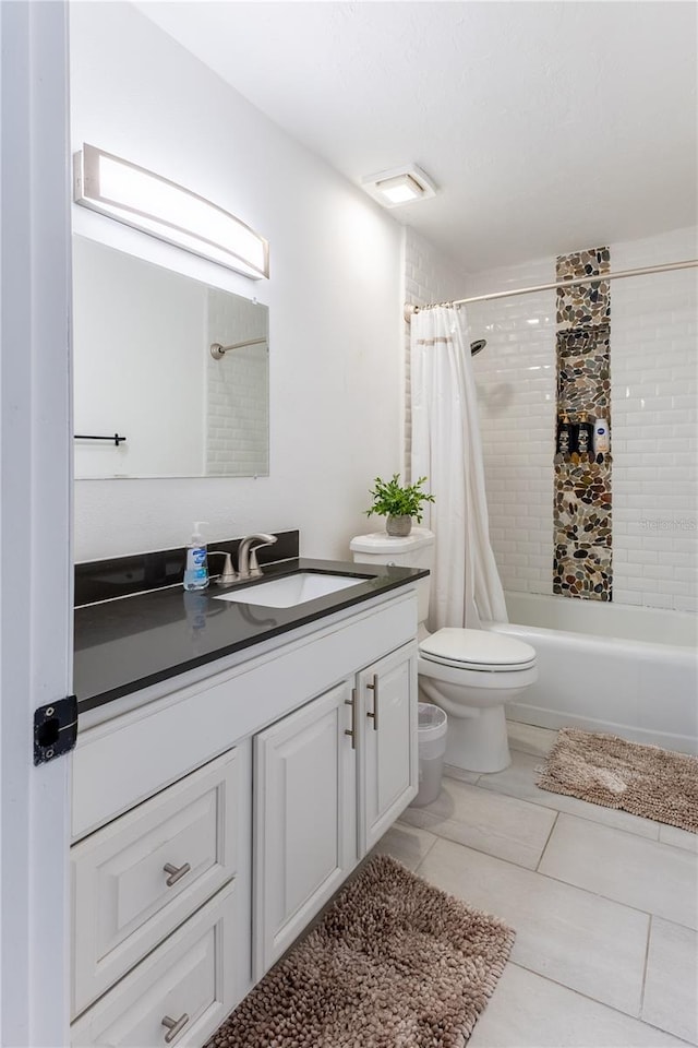 full bathroom featuring tile patterned floors, vanity, shower / tub combo, and toilet