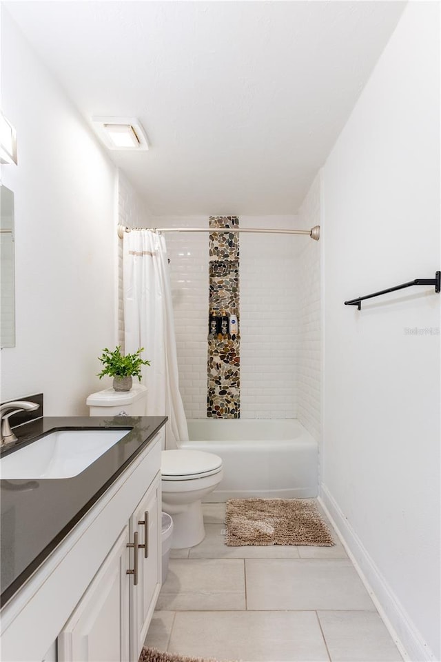 full bathroom featuring tile patterned floors, vanity, toilet, and shower / bathtub combination with curtain