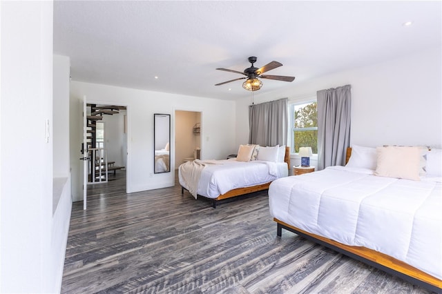 bedroom featuring dark hardwood / wood-style flooring and ceiling fan