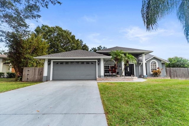 single story home featuring a garage and a front yard