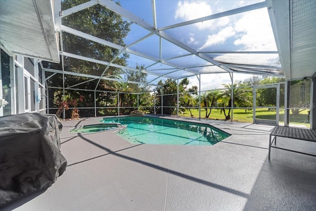 view of swimming pool featuring an in ground hot tub, a patio, glass enclosure, and grilling area