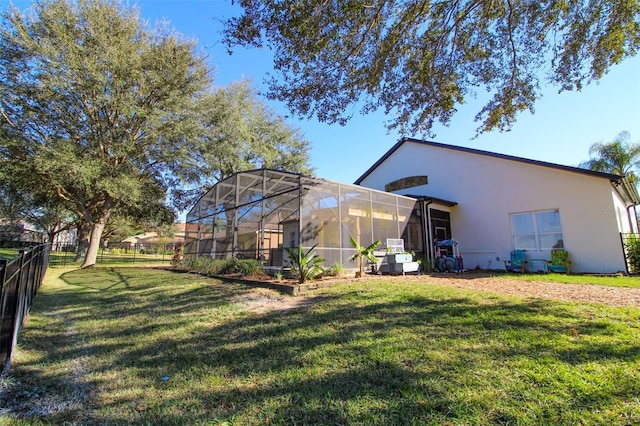 view of yard featuring glass enclosure