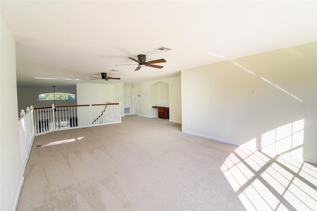 unfurnished room with light colored carpet