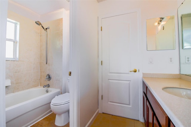 full bathroom with vanity, tile patterned flooring, toilet, and tiled shower / bath