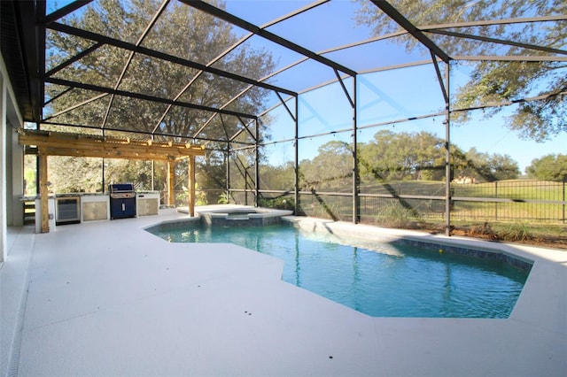 view of pool with an outdoor kitchen, an in ground hot tub, a lanai, grilling area, and a patio area