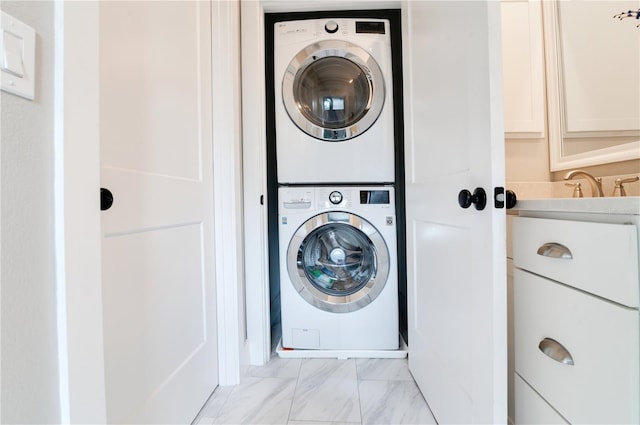 washroom with stacked washer / dryer