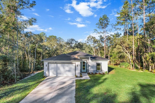 view of front of house featuring a garage and a front lawn