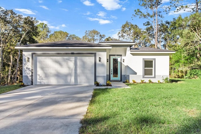 view of front of property with a garage and a front yard