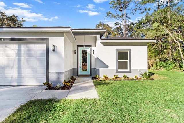 view of front of home with a garage and a front lawn