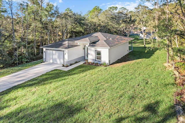 view of front of house with a garage and a front lawn