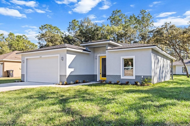 view of front of property with a garage and a front lawn