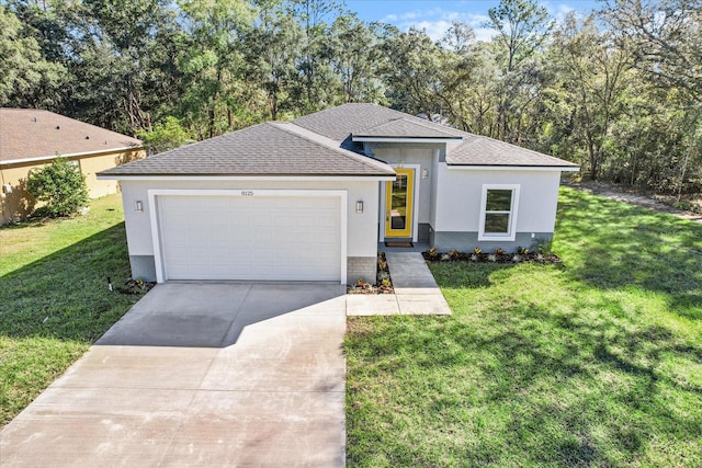 view of front of property featuring a garage and a front yard