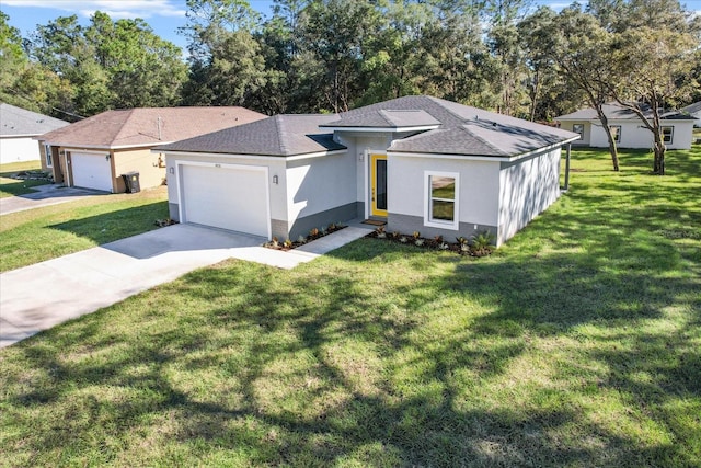 view of front facade with a garage and a front yard