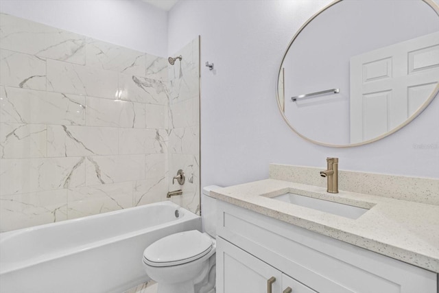 full bathroom with toilet, vanity, and tiled shower / bath