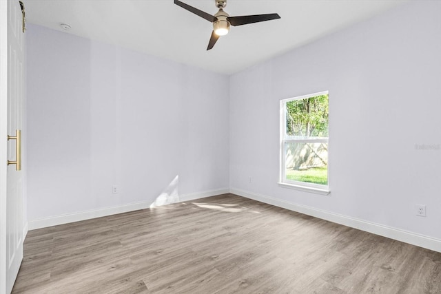 spare room with light hardwood / wood-style flooring and ceiling fan