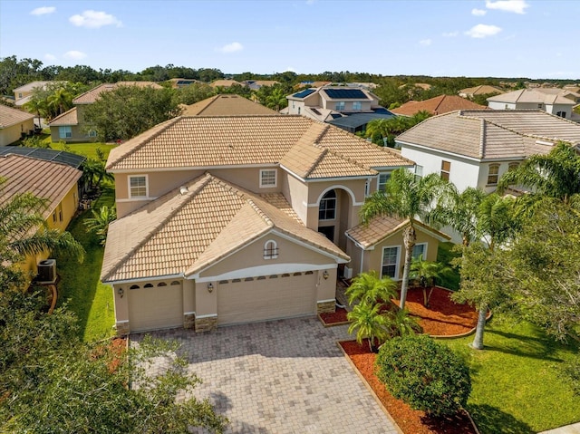 view of front of home featuring a front yard and a garage