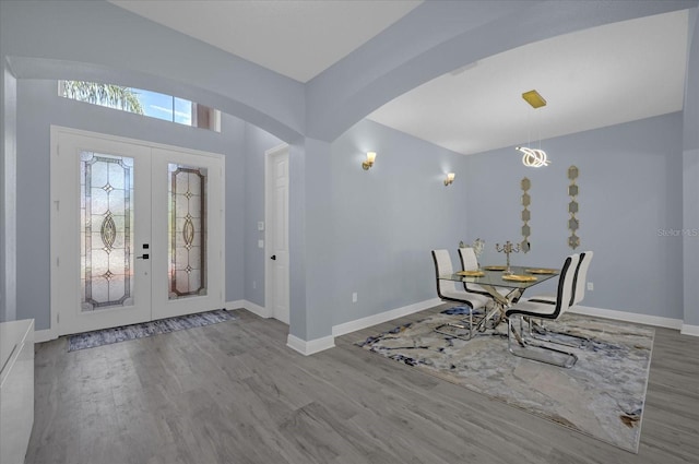 entrance foyer with french doors and light wood-type flooring