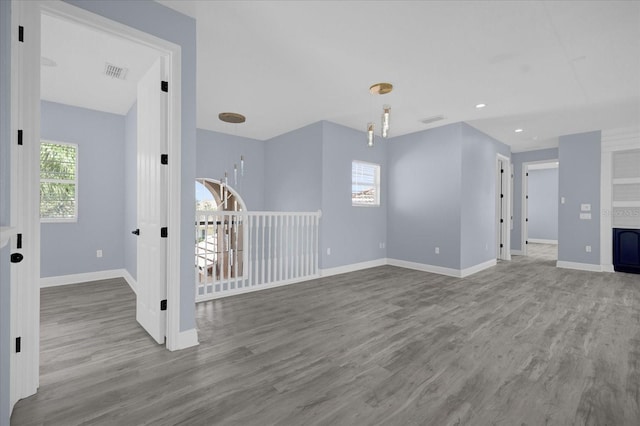 unfurnished living room featuring hardwood / wood-style floors