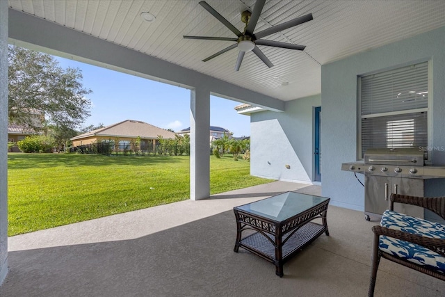 view of patio featuring area for grilling and ceiling fan