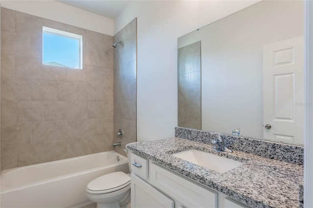 full bathroom with tiled shower / bath combo, toilet, and vanity