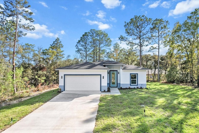 view of front of property with a front lawn and a garage