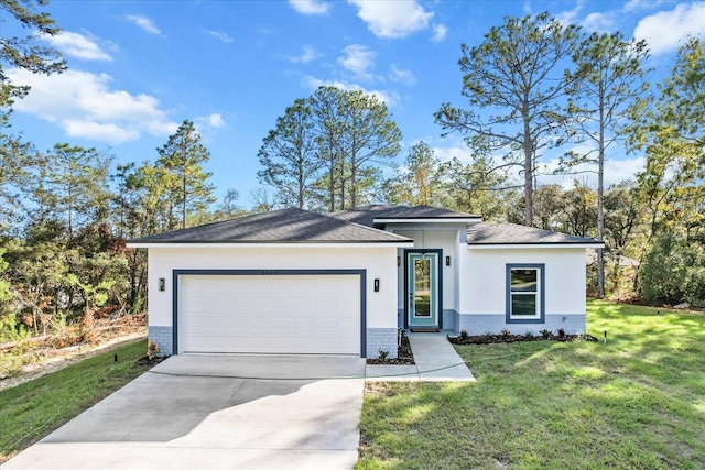 view of front of house featuring a garage and a front yard