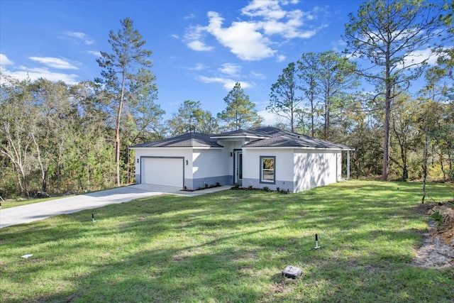 view of front of property featuring a garage and a front lawn