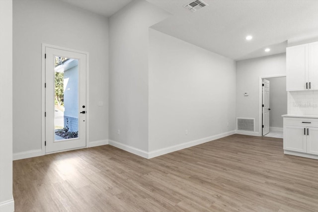 foyer with light hardwood / wood-style floors