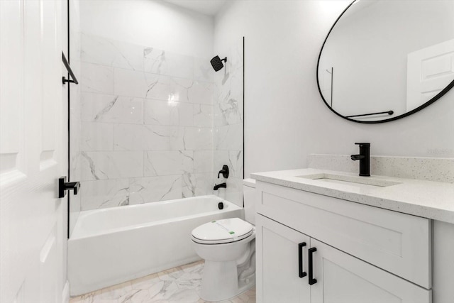 full bathroom with toilet, vanity, and tiled shower / bath