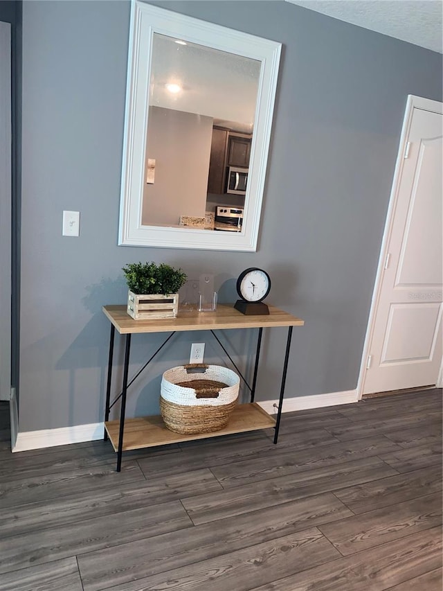 room details with wood-type flooring and appliances with stainless steel finishes