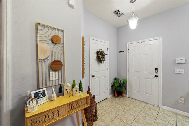 foyer with light tile patterned flooring