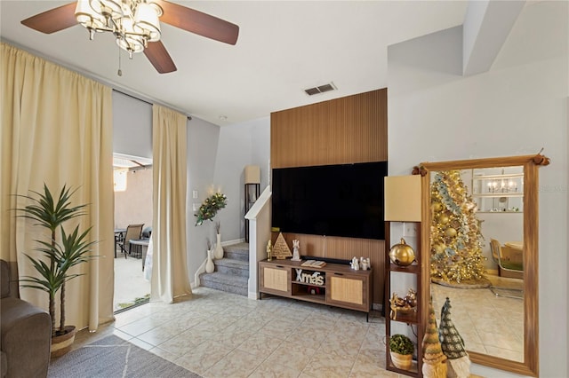 living room with ceiling fan and light tile patterned floors