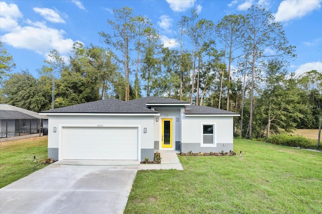 view of front of property with a garage and a front yard