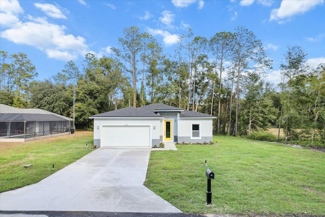 view of front of property with a front lawn and a garage