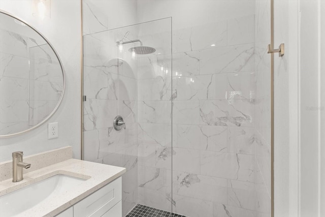 bathroom featuring vanity and a tile shower