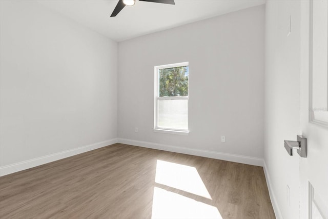 unfurnished room featuring ceiling fan and hardwood / wood-style floors