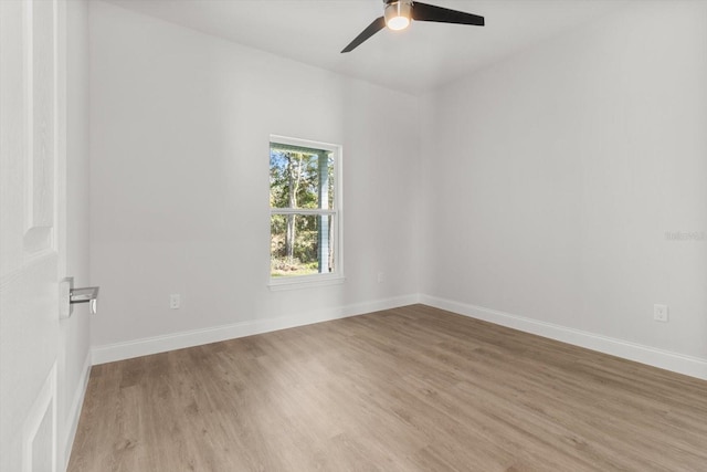 empty room with ceiling fan and light wood-type flooring