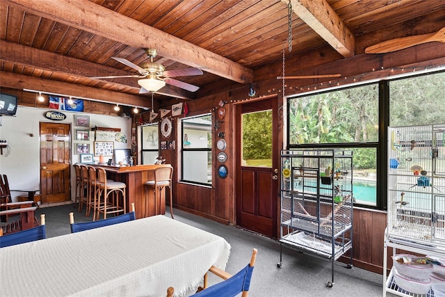 bedroom with multiple windows and wood ceiling