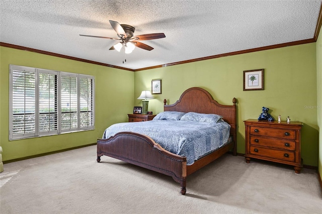 carpeted bedroom featuring ceiling fan, crown molding, and a textured ceiling