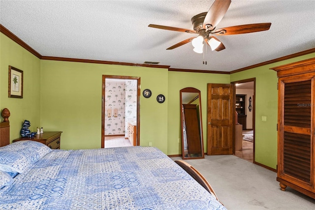 bedroom featuring a textured ceiling, light colored carpet, ceiling fan, and connected bathroom