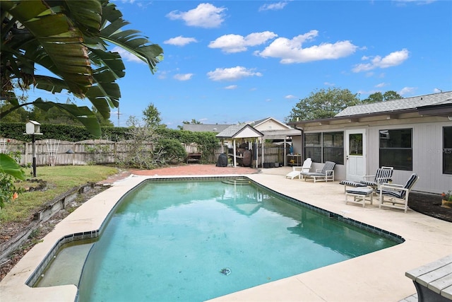 view of swimming pool with a gazebo and a patio area