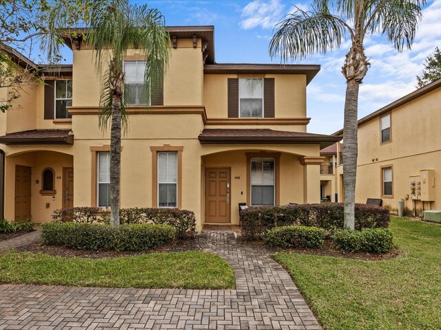 408 Miramar Ave, Davenport, FL 33897 - view of front of home with stucco siding and a front yard