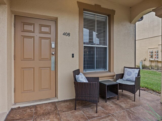 408 Miramar Ave, Davenport, FL 33897 - property entrance with stucco siding