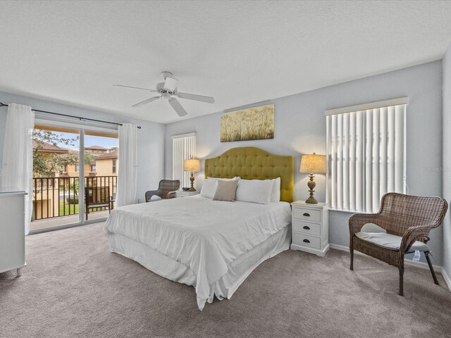 408 Miramar Ave, Davenport, FL 33897 - bedroom with access to outside, carpet flooring, a ceiling fan, a textured ceiling, and baseboards